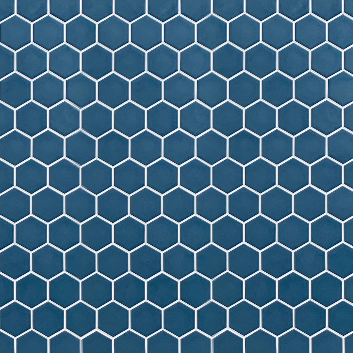 Display board featuring Wave Navy Blue 2-inch Hexagon Matte Porcelain Mosaic Tile – elegant navy blue pattern layout.