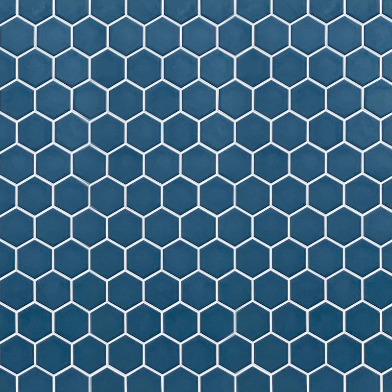 Display board featuring Wave Navy Blue 2-inch Hexagon Matte Porcelain Mosaic Tile – elegant navy blue pattern layout.