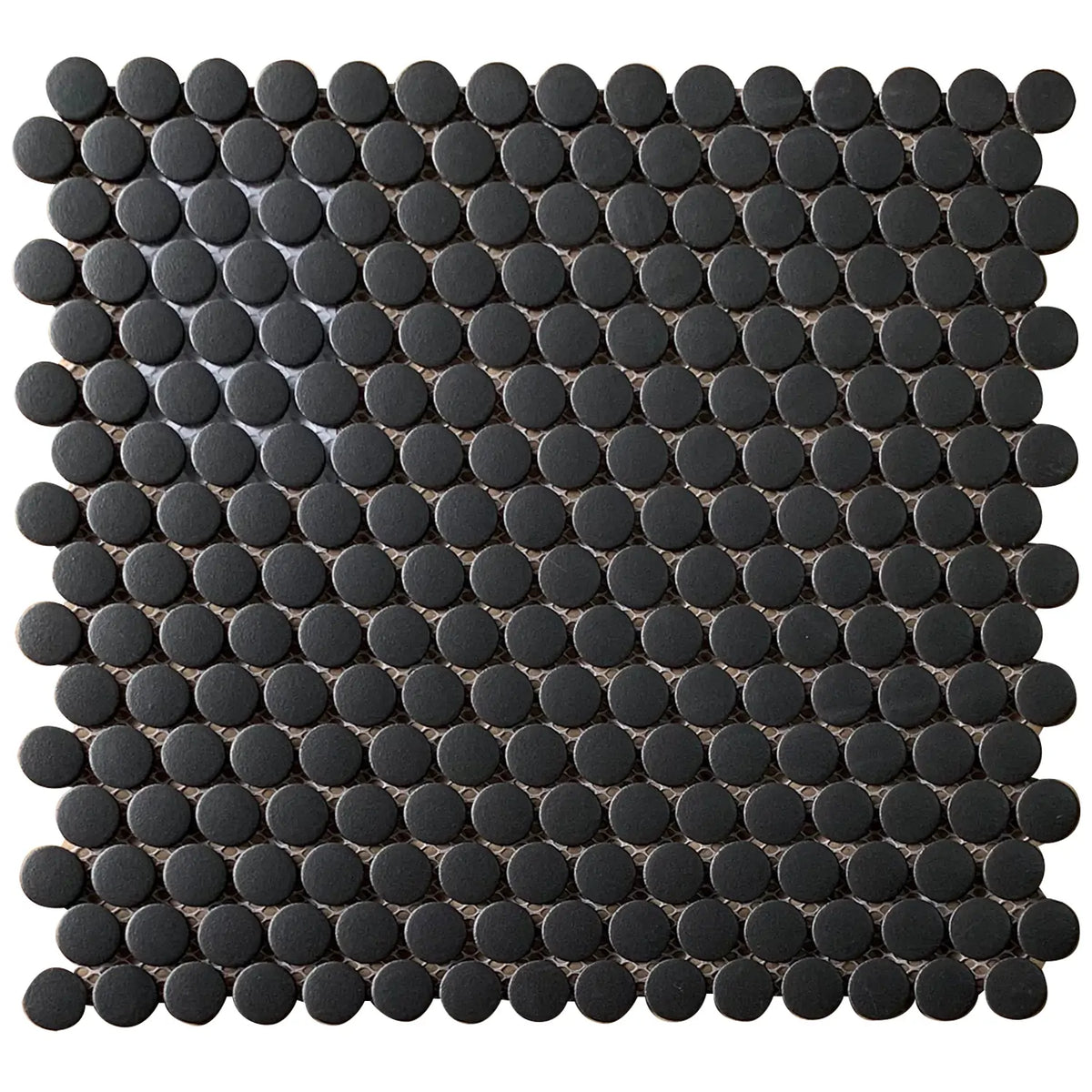 Matte glazed black penny round mosaic tile – 12.4-in x 11.5-in for wall and floor applications.