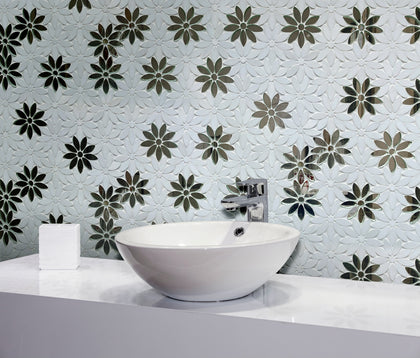 Bathroom wall decorated with Interlocking Floral Waterjet Mosaic Tile – reflective antique mirror accents combined with Thassos marble.
