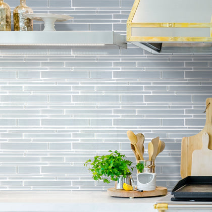 Modern kitchen backsplash with Ice Denim Glass Mix Random Strip Tiles – cool icy blue tones adding refreshing style.