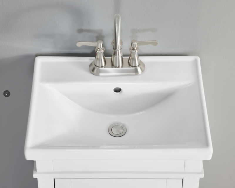 Elmington white vanity with porcelain top sink featuring a sleek faucet and elegant design for small spaces.