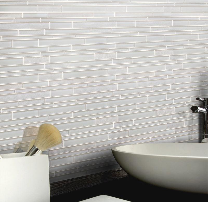 Bathroom wall decorated with White Staccato Marble & Glass Random Strips Mosaic Tiles – clean and luminous white marble with glass details.