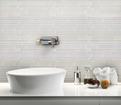Bathroom wall decorated with White Staccato Marble & Glass Random Strips Mosaic Tiles – clean and luminous white marble with glass details.