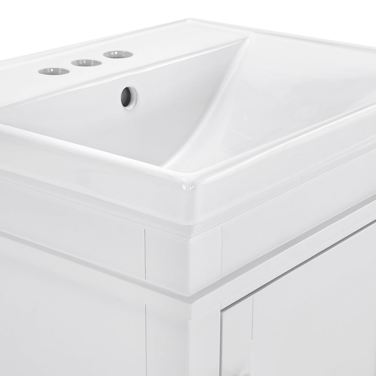 Close-up of Elmington white vanity with porcelain top showcasing sleek design and faucet holes.