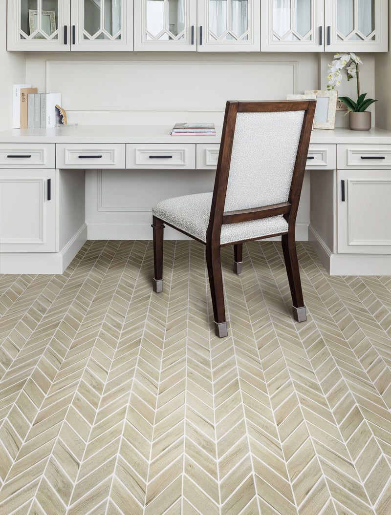 Chevron porcelain tile with wood texture on living room feature wall – elegant warm tones