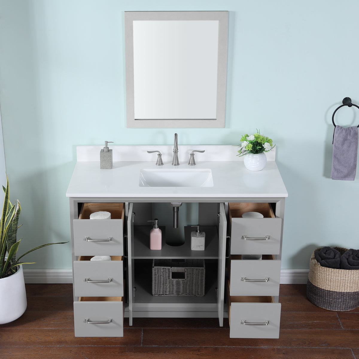 Gray single vanity with quartz top featuring modern design, ample storage, and a sleek basin setup.