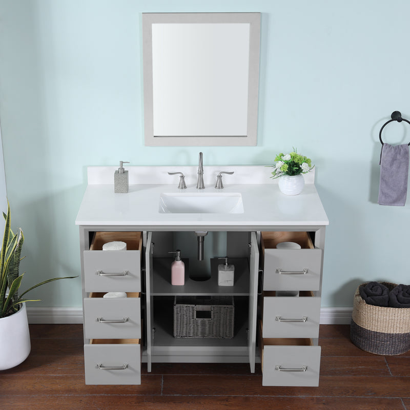 Gray single vanity with quartz top featuring modern design, ample storage, and a sleek basin setup.