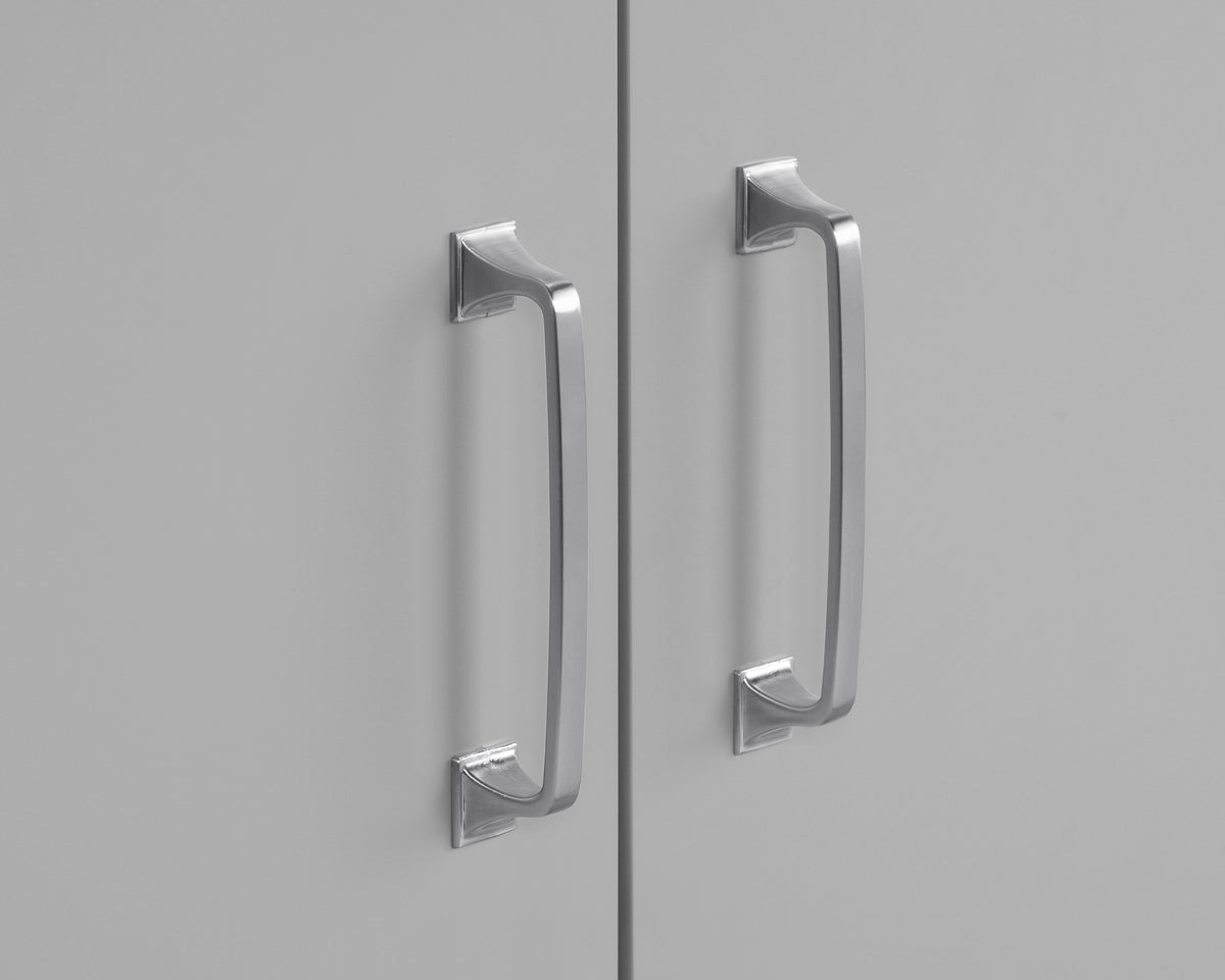 Close-up of sleek silver handles on a 60 inch gray double vanity with quartz top.