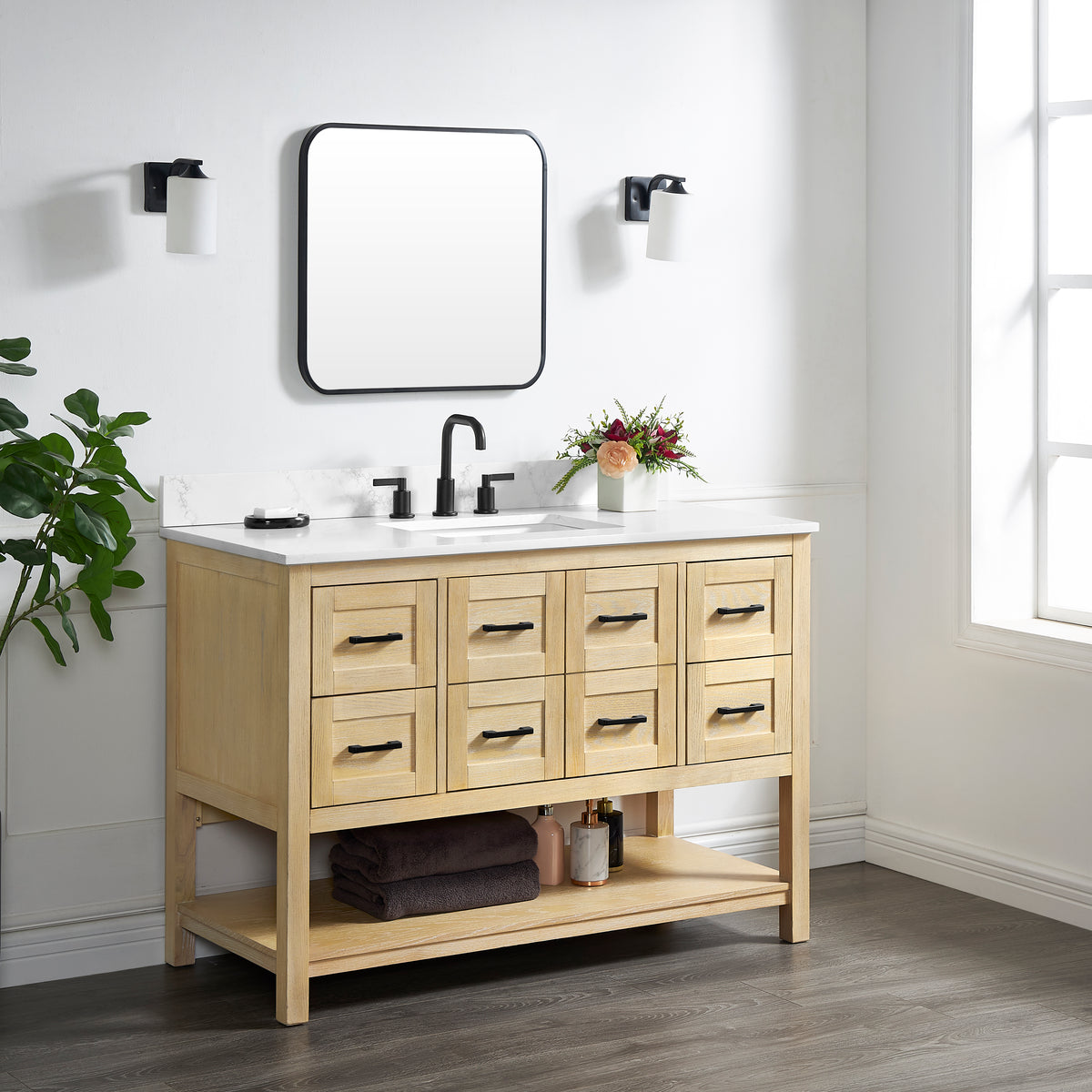 Natural oak vanity base with eight drawers and white countertop in a modern bathroom setting.