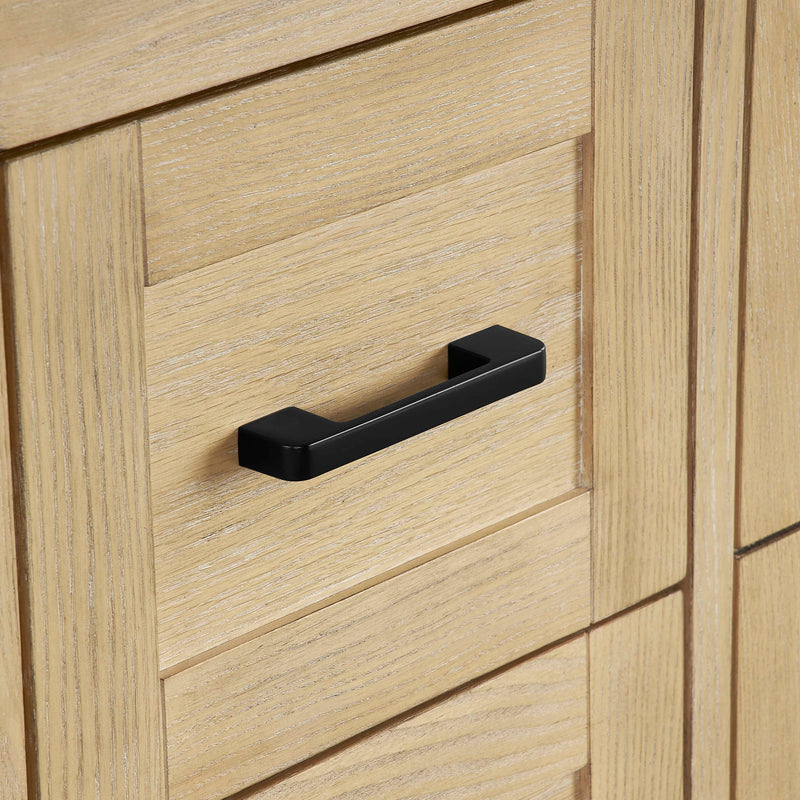 Close-up of the natural oak vanity base drawer with black handle details.