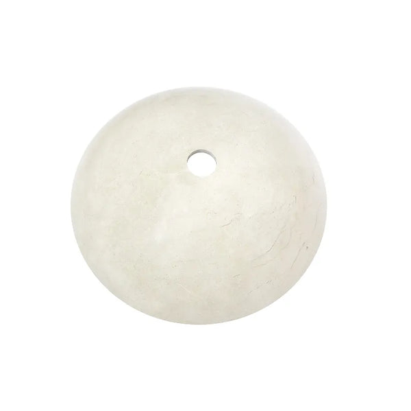 Carrara white marble vessel sink with a round design showcasing the natural stone texture and a central drain hole.