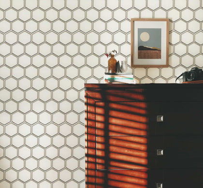 Living room design showcasing 9x11 inch 3” Hexagon Silver Glass Mosaic Tiles with Silver Trim – a contemporary and luxurious touch with hexagonal tiles and silver detailing
