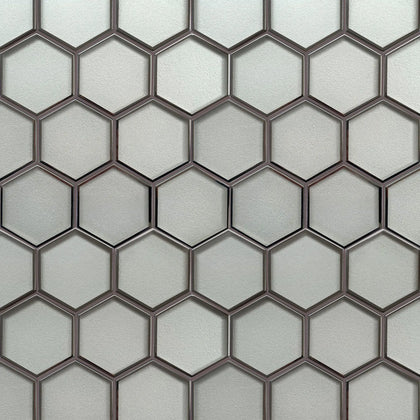 Sample display board of 9x11 inch 3” Hexagon Silver Glass Mosaic Tiles with Silver Trim – showcasing modern hexagonal pattern with silver accents