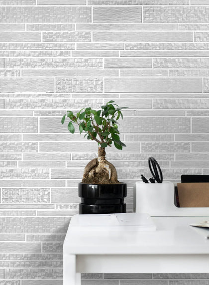 Bathroom wall with 6x18 inch Pure Glass Mix Mosaic Tiles – random strip design adds a chic, modern touch to the bathroom decor