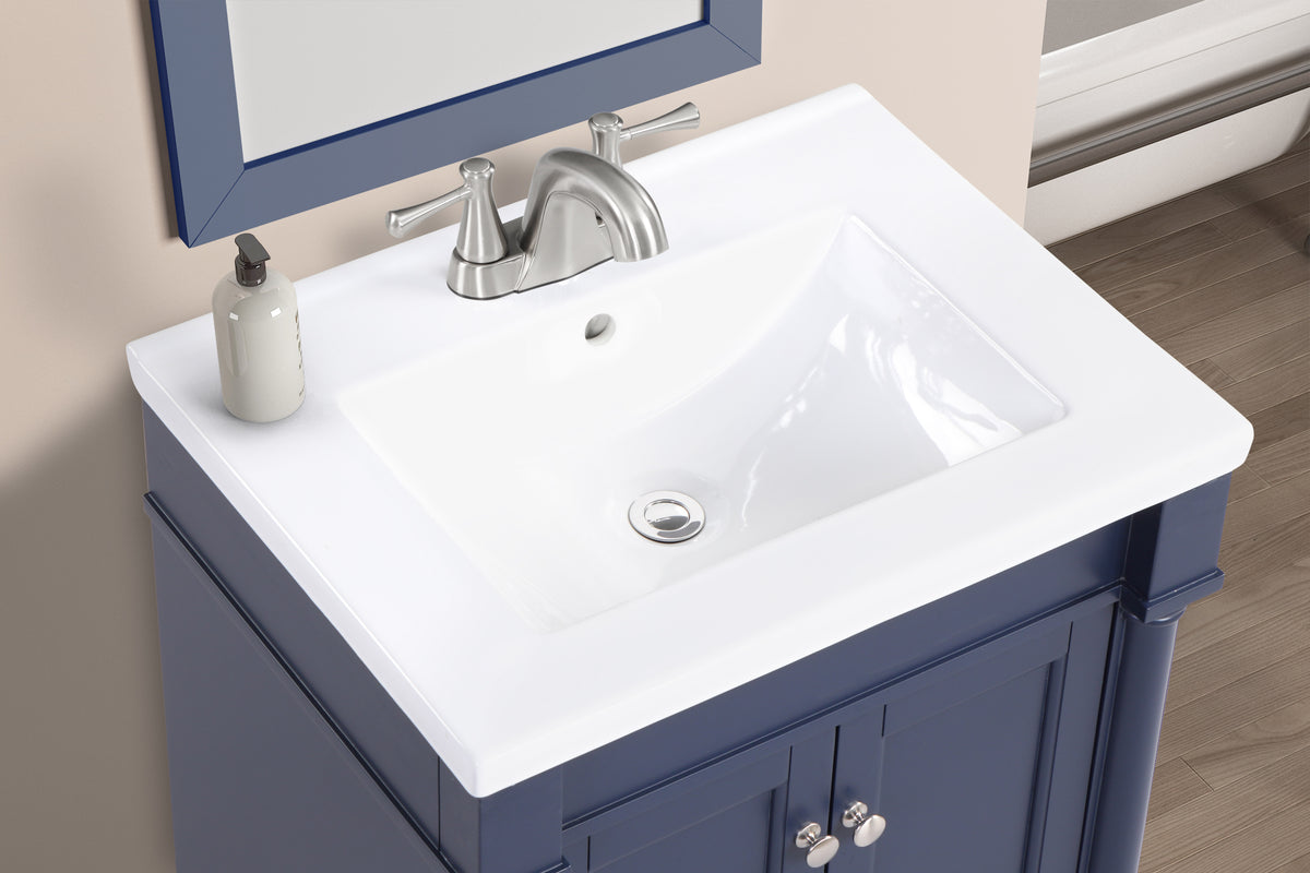Top view of a white sink on a Torino 24" navy blue bathroom vanity with a stylish faucet and soap dispenser.