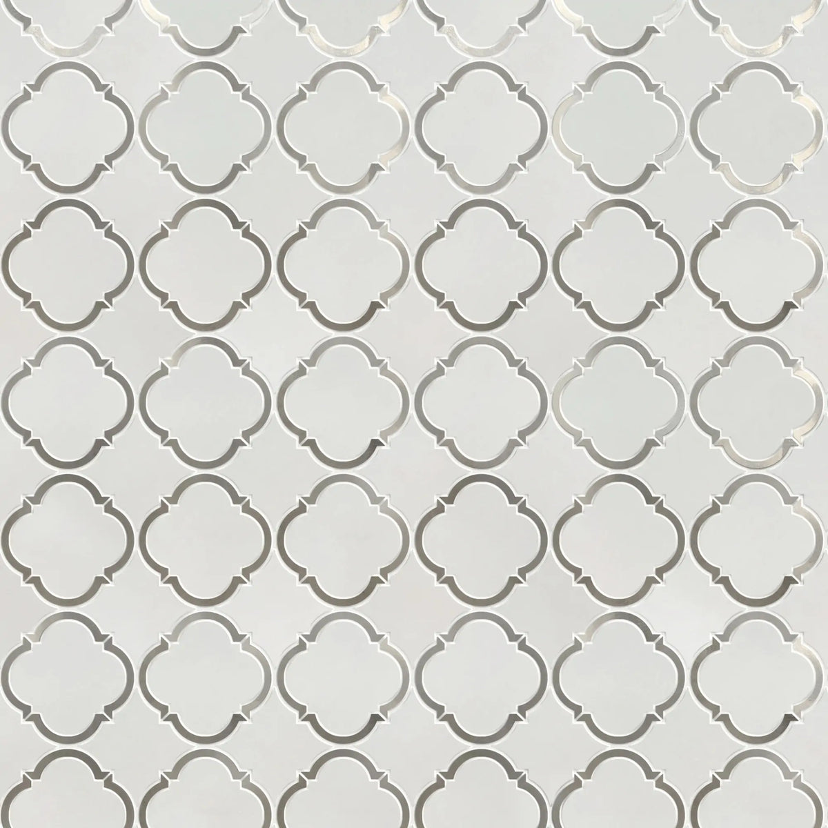 Sample board of Thassos & Patterned Metal Trim Waterjet Mosaic Tile – elegant showroom presentation of marble and metal combination