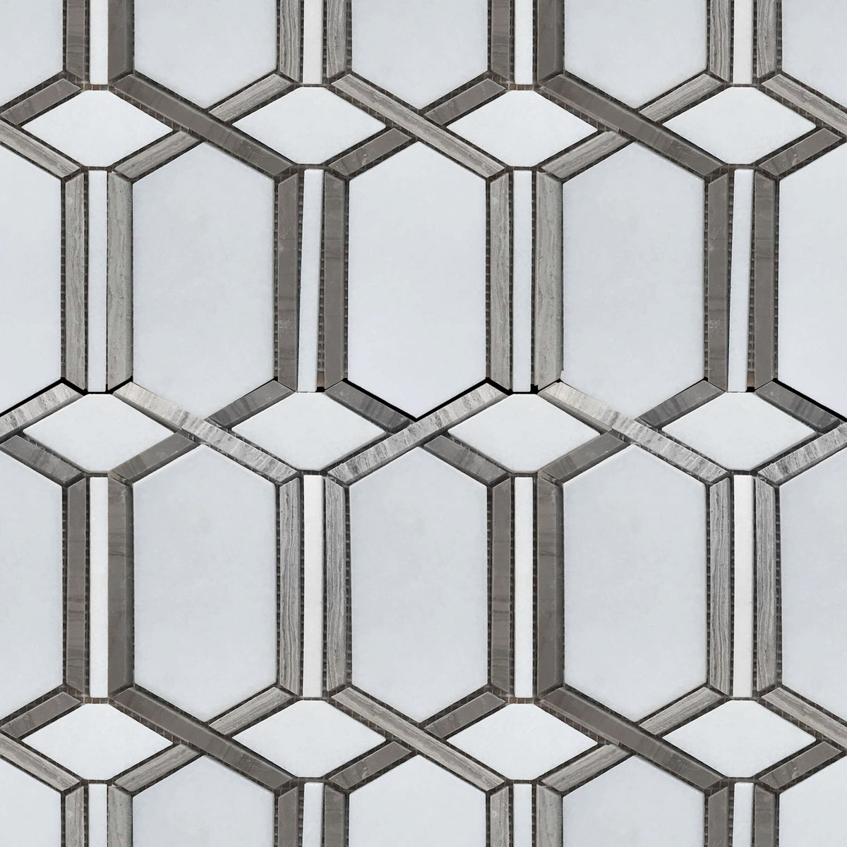 Sample board showing 12x12 inch polished waterjet mosaic with mixed materials – white, brown, and gray tile combination