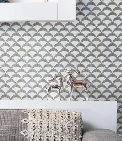 Bathroom accent wall featuring Thassos & Shell Waterjet Tile – polished surface with luxurious gold highlights
