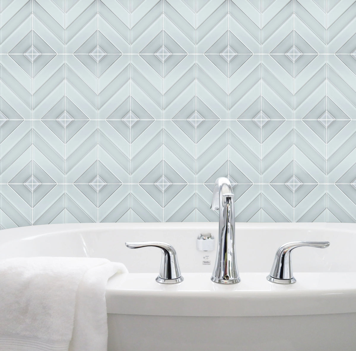 Bathroom wall featuring 12x12 inch Diamond Chevron Glass Mosaic Tiles with Metallic Edge – chic chevron pattern with metallic finish for a modern bathroom