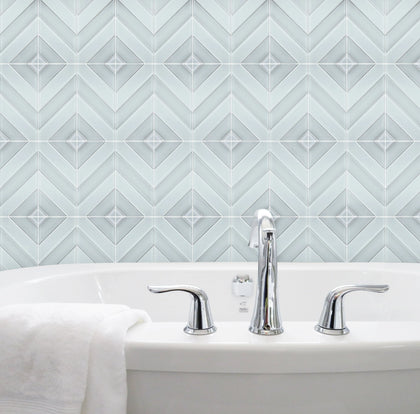 Bathroom wall featuring 12x12 inch Diamond Chevron Glass Mosaic Tiles with Metallic Edge – chic chevron pattern with metallic finish for a modern bathroom