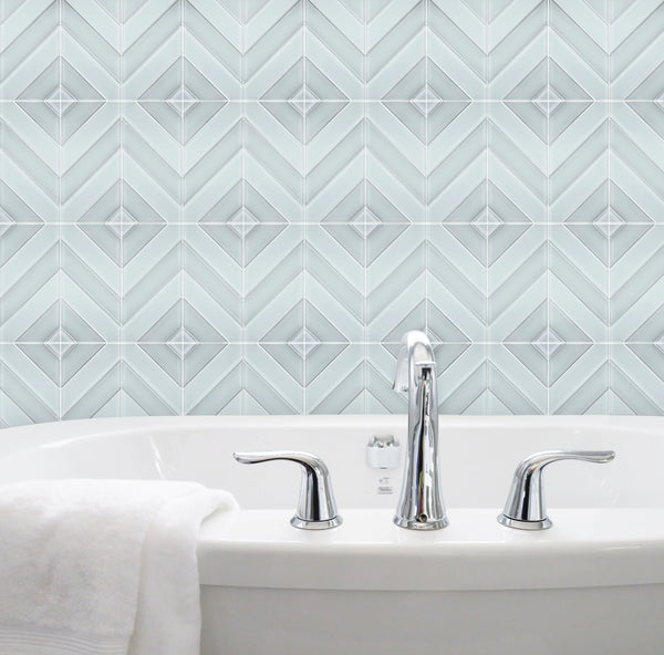 Bathroom wall featuring 12x12 inch Diamond Chevron Glass Mosaic Tiles with Metallic Edge – chic chevron pattern with metallic finish for a modern bathroom