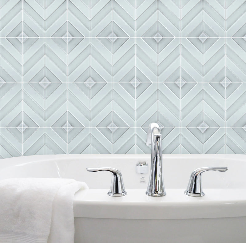 Bathroom wall featuring 12x12 inch Diamond Chevron Glass Mosaic Tiles with Metallic Edge – chic chevron pattern with metallic finish for a modern bathroom