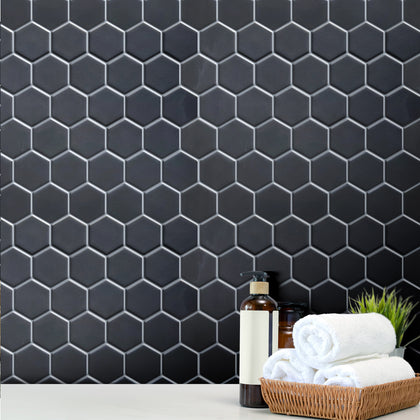 Modern kitchen backsplash using 2-inch Black Hexagon Matte Mosaic Tile – striking contrast with white cabinets.