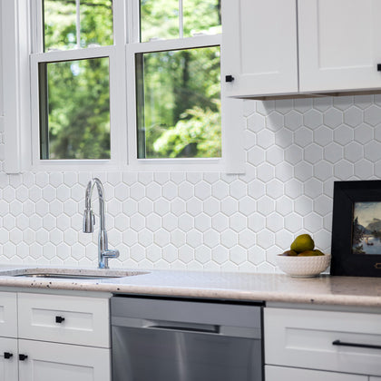 Modern kitchen backsplash featuring White 2-inch Hexagon Matte Porcelain Tiles – a minimalist, clean look using 12x12 mosaic sheets.