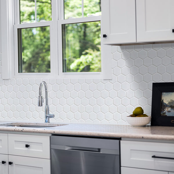 Modern kitchen backsplash featuring White 2-inch Hexagon Matte Porcelain Tiles – a minimalist, clean look using 12x12 mosaic sheets.