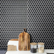Kitchen design using black penny round tile – porcelain mosaic adds bold texture and contrast.