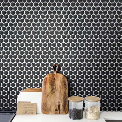 Kitchen design using black penny round tile – porcelain mosaic adds bold texture and contrast.