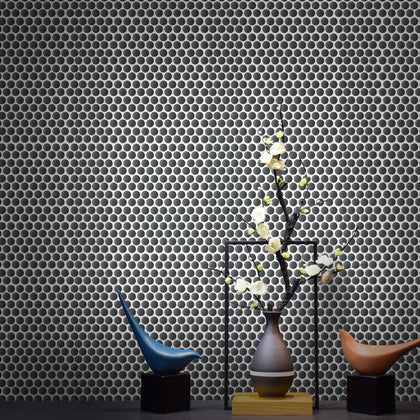 Black penny round mosaic flooring in contemporary living space – 12.4-in x 11.5-in porcelain tile.