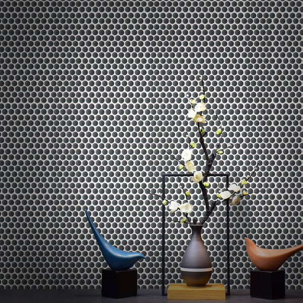 Black penny round mosaic flooring in contemporary living space – 12.4-in x 11.5-in porcelain tile.