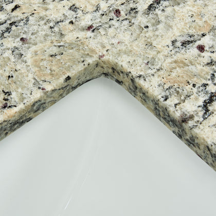 Close-up of 43" Santa Cecilia granite vanity top with sink, highlighting the polished edge and natural stone texture.