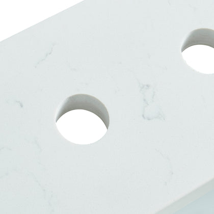 Close-up detail of 31-inch Carrara White Quartz vanity top showing pre-drilled faucet holes and marble-style veining.